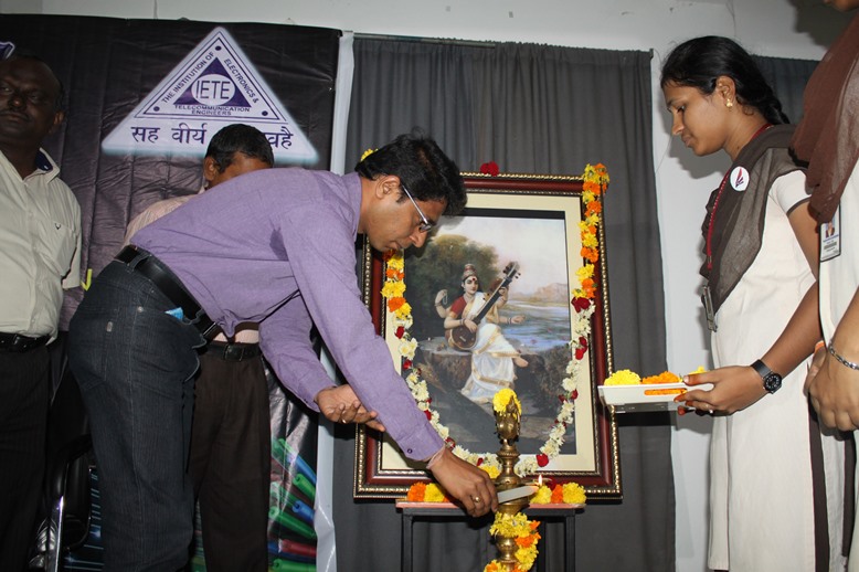 B.Bhaskar Rao lighting the lamp
